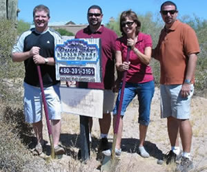 Anna and Lane G breaking ground with Mike and Charlie Frat for their new custom home